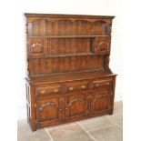 An aged oak dresser. W169cm D41cm H190cm