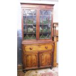 A Georgian mahogany cabinet bookcase with secretaire drawer. W109cm D52cm H232cm