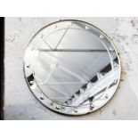 An Art Deco mirror. Diam. 46cm