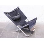 A modernist folding chrome lounge chair