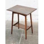 An Edwardian Arts and Crafts style oak occasional table stamped ^H Dancey^. H72cm