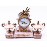 A gilt metal and pink onyx clock garniture. H34cm