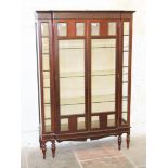 An Edwardian mahogany display cabinet. W122cm D39cm H179cm