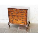 A Georgian walnut chest of drawers on cabriole legs. W103cm D53cm H108cm