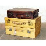 Three vintage suit cases comprising two pig skin and one brown leather