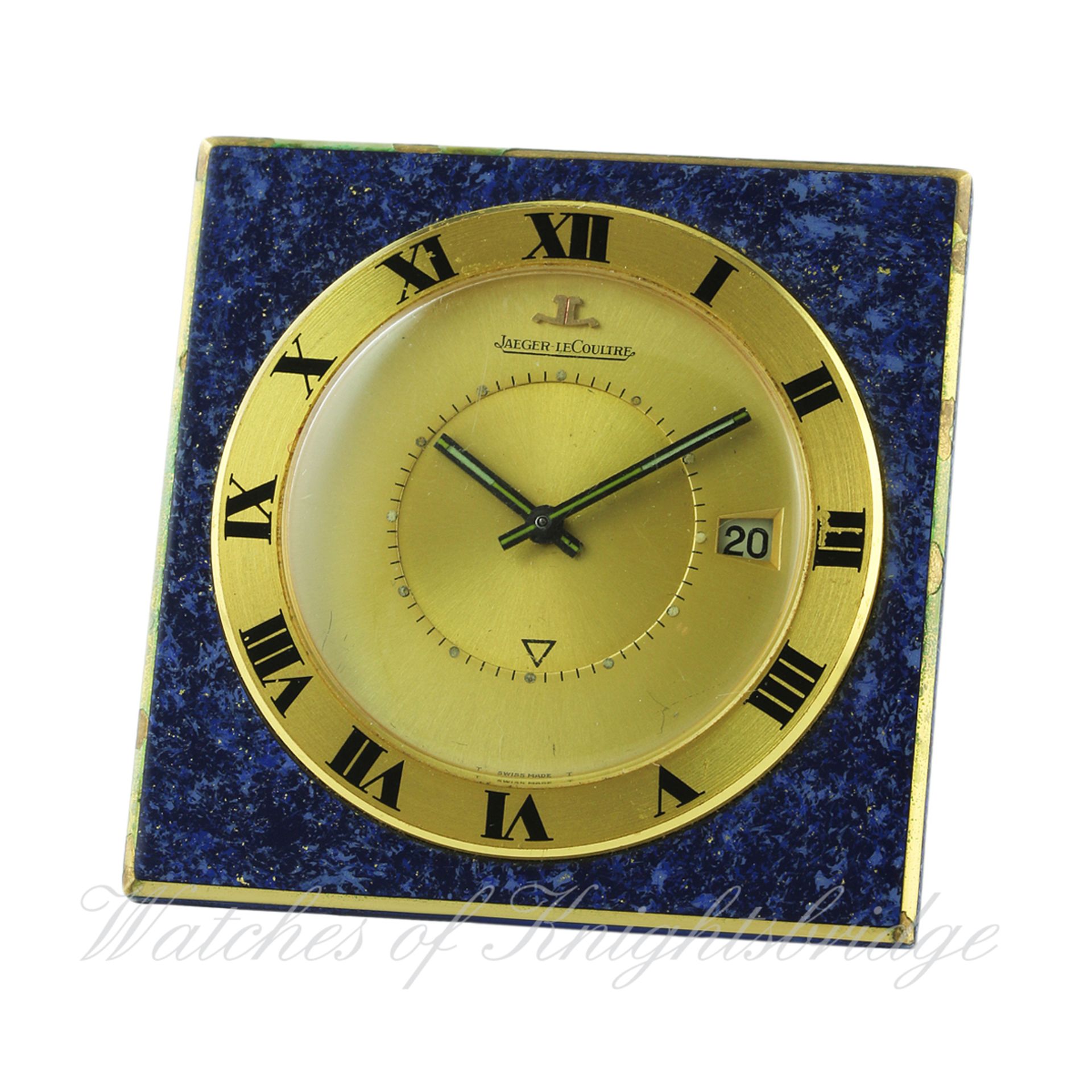 A GILT METAL LACQUERED JAEGER LECOULTRE ALARM TRAVEL CLOCK CIRCA 1970 IN ORIGINAL JLC POUCH
D: Two