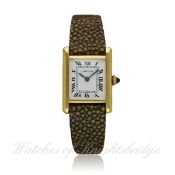 A LADIES 18K SOLID GOLD CARTIER TANK WRIST WATCH CIRCA 1980s D: White dial with Roman numerals &