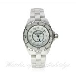 A LADIES MID SIZE WHITE CERAMIC & DIAMOND CHANEL J12 BRACELET WATCH DATED 2010, REF. H1628 WITH
