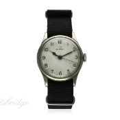 A GENTLEMAN'S BRITISH MILITARY H.S.8 OMEGA WRIST WATCH CIRCA 1943, REF. 2292
D: Silver dial with