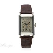 A GENTLEMAN'S STAINLESS STEEL OMEGA WATERPROOF WRIST WATCH CIRCA 1939
D: Silver dial with luminous