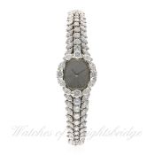 A FINE LADIES PLATINUM & DIAMOND LECOULTRE BRACELET WATCH CIRCA 1970s
D: Sunburst dial. M: 17