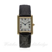 A GENTLEMAN'S 18K SOLID GOLD CARTIER TANK WRIST WATCH CIRCA 1990
D: White dial with black Roman