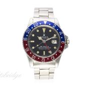 A GENTLEMAN'S STAINLESS STEEL ROLEX OYSTER PERPETUAL DATE GMT MASTER BRACELET WATCH CIRCA 1970, REF.
