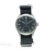 A GENTLEMAN'S STAINLESS STEEL BRITISH MILITARY W.W.W. OMEGA WRIST WATCH CIRCA 1944
D: Black dial