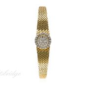 A LADIES 18K SOLID GOLD & DIAMOND OMEGA BRACELET WATCH CIRCA 1960s
D: Silver dial with black