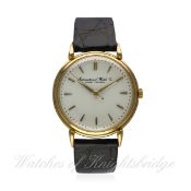 A GENTLEMAN'S LARGE SIZE 18K SOLID GOLD IWC WRIST WATCH CIRCA 1950s
D: Silver dial with gilt
