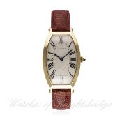 A FINE GENTLEMAN'S 18K SOLID GOLD CARTIER TONNEAU WRIST WATCH CIRCA 1990s D: Silver guilloche dial