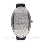 A LARGE STAINLESS STEEL DIAMOND SET WRIST WATCH BY MARCO MAVILLE "OVAL ONE" CIRCA 2010, REF. 1277,