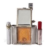 A RARE SILVER PLATED DUNHILL COMPACT CIRCA 1930s 
C: Engine turned case concealing a lipstick,