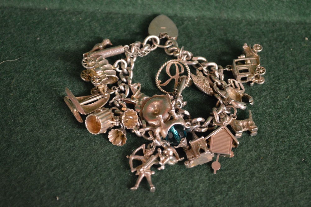 A silver charm bracelet to also comprise