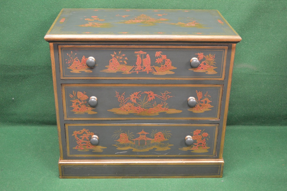 A green painted chest of drawers decorat