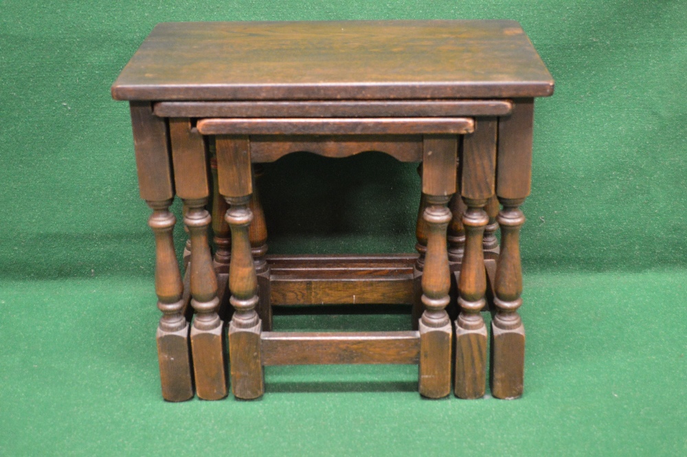 A nest of three oak occasional tables ha