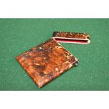 A possibly tortoiseshell card case with