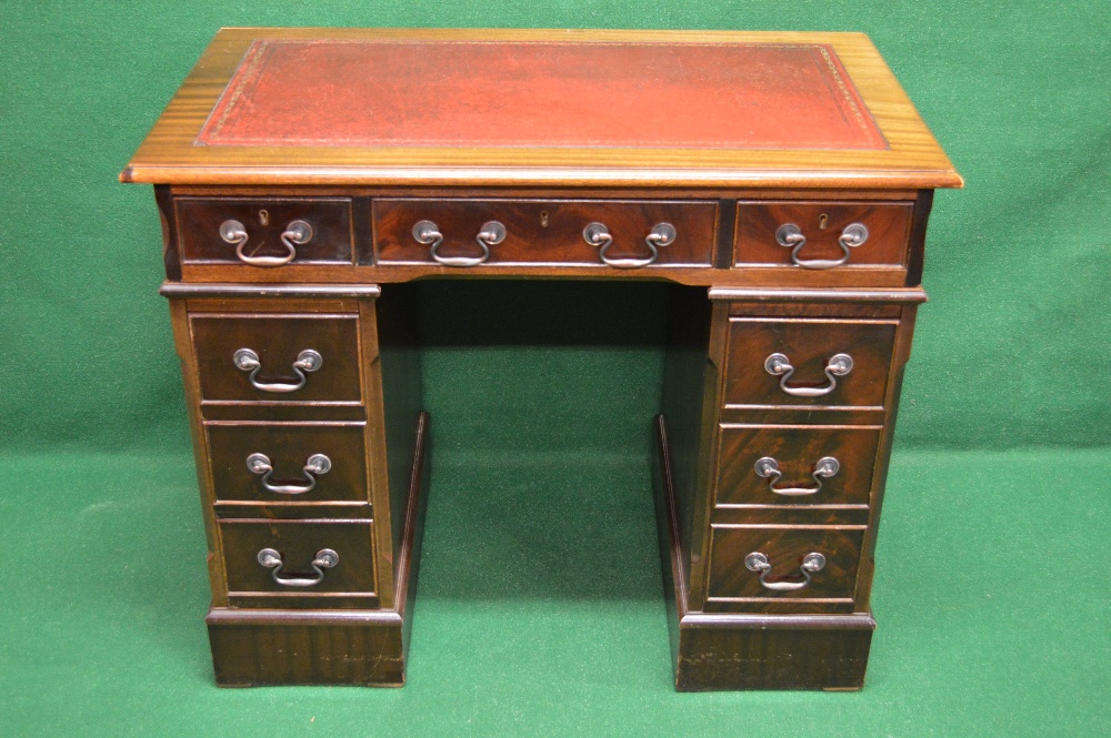 A 20th century mahogany pedestal desk ha