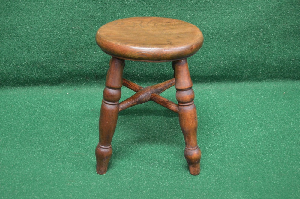 A small circular stool supported on turn