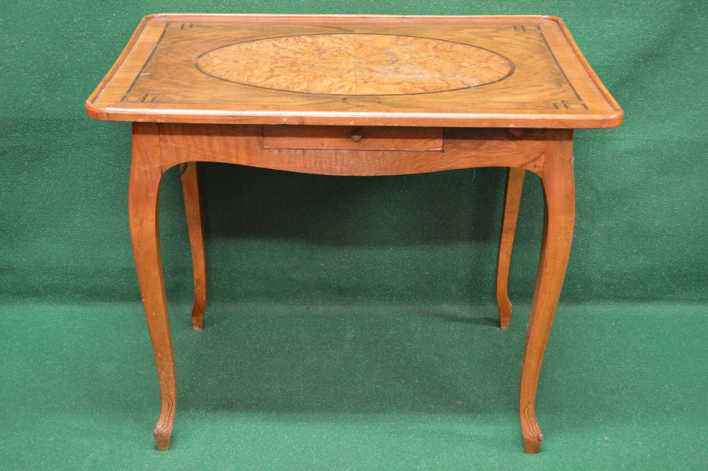 A walnut and burr walnut centre table th