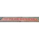Red and cream carpet runner with blue an