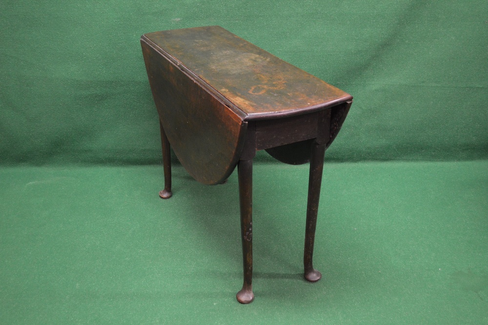 A mahogany drop leaf table having bow en