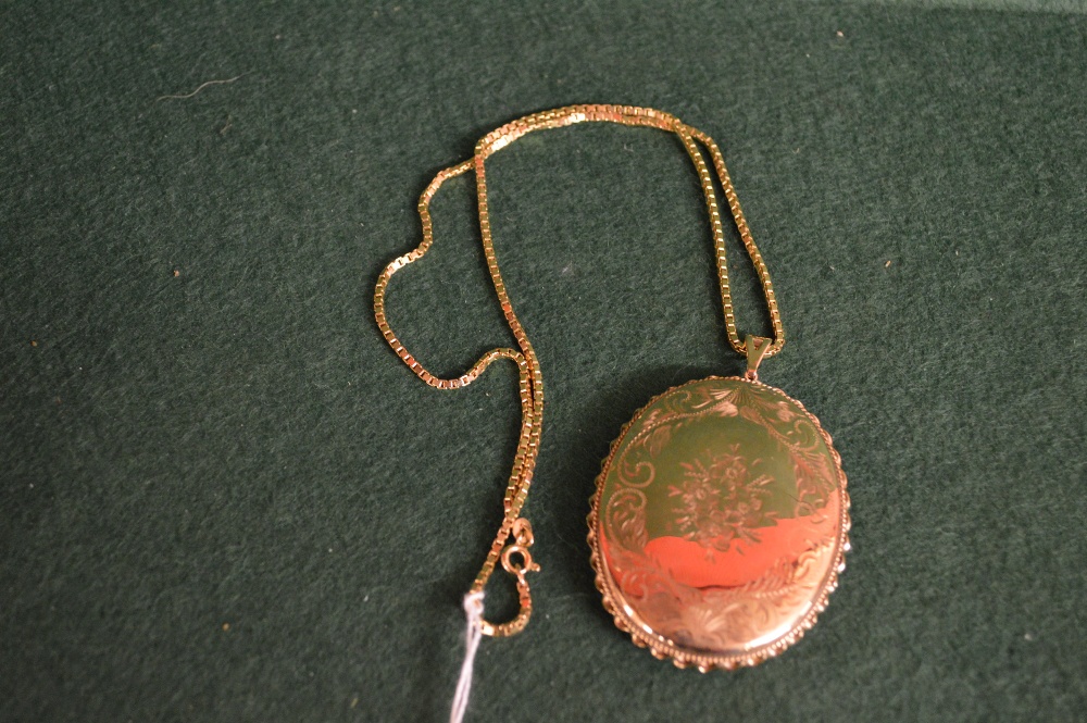 A large 9ct gold locket and chain