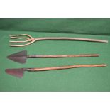 Three antique long handled agricultural