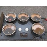 Five 9" dia ampere meters mounted onto a