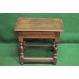 An oak joint stool having moulded edge,