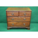 Mahogany cross banded chest of drawers having two short and two long drawers with brass handles,