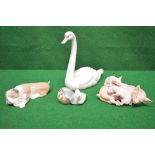 Group of four Lladro figures of animals to include pigs,