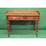 William IV mahogany two drawer writing table with 3/4 raised gallery and standing on reeded legs