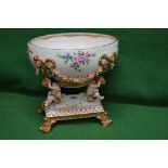 20th century Meissen style centre piece having large oval blue ground bowl decorated with bows and