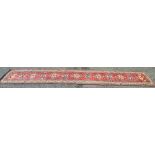 Red and cream carpet runner with blue and red pattern - 156" x 33.