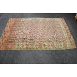 Red ground rug having blue,