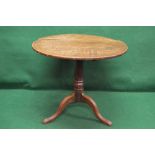 Oak tip top tavern table having circular top supported by turned column leading to three swept legs