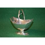 Victorian silver sugar basket with swing handle and pedestal foot,