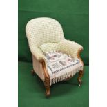 Victorian walnut armchair with arched back and scrolled arms,