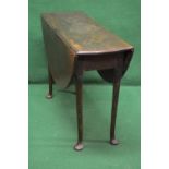 A mahogany drop leaf table having bow ends and D shape drop leaves,