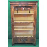 A mahogany display cabinet having glazed sides and door enclosing four fixed shelves over single