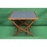 Walnut folding coaching table opening to reveal green baized surface,