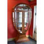 Possibly Harrods mid to late 20th century walnut Art Deco urn shape display cabinet with dome