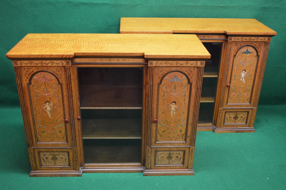 Pair of satinwood inlaid and painted inverted breakfront side cabinets having central glazed door